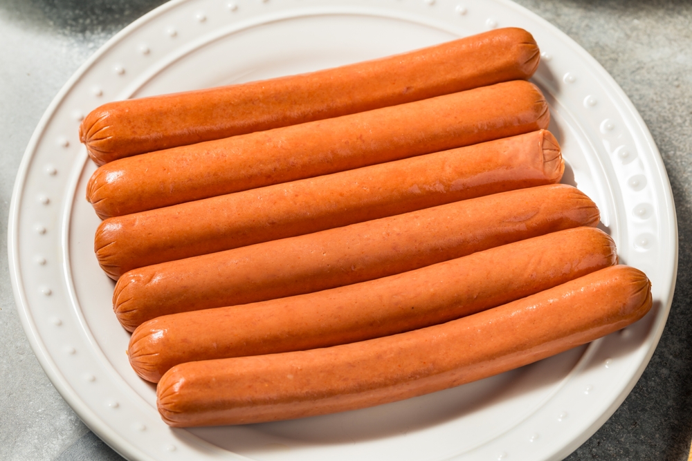 uncooked sausages on a plate