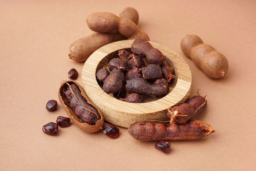 a bowl of tasty tamarinds and seeds