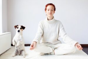 woman-owner-medidating-with-her-jack-russell-terrier