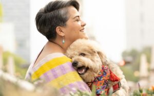 Cute poodle with woman